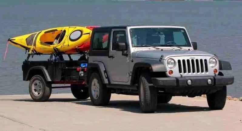 Jeep Trailer M416 towed by a Jeep Wrangler with Kayak Rracks